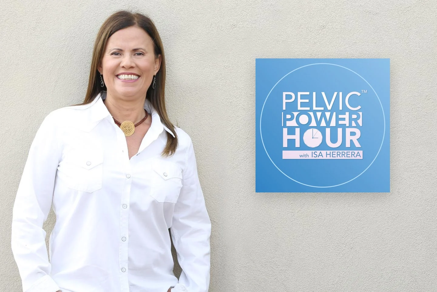 Isa Herrera standing against a stucco wall beside the Pelvic Power Hour podcast logo.